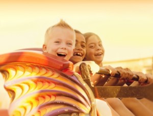 22251994 - kids on a summertime roller coaster ride